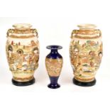 A pair of Japanese vases, height 30cm, together with a Doulton Lambert vase, height 22cm.