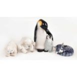 ROYAL COPENHAGEN; a figure of a penguin with chick, together with two polar bears and a cat, largest