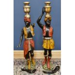 A pair of early 20th century Blackamoor figures, height 140cm.Condition Report: Both are heavily