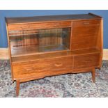G-PLAN; a mid century teak sideboard with an arrangement of three drawers, pull-down door and a pair