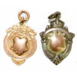 A 9ct gold fob, 3g, and a hallmarked silver example (2)