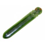 A Maori nephrite jade paper knife decorated with a tiki, length 12cm.Condition Report: Tiny chip