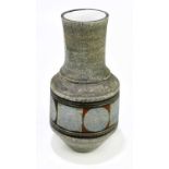 ANN LEWIS FOR TROIKA POTTERY; an urn vase decorated with a single band of circles on a green ground,