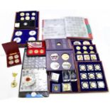 A large quantity of predominantly British coins including proof set, album containing various
