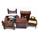 A late Victorian inlaid mahogany miniature four piece bedroom suite comprising chest of a wardrobe