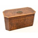 A 19th century yew wood, burr yew, and inlaid tea caddy of rectangular form with cantered corners,