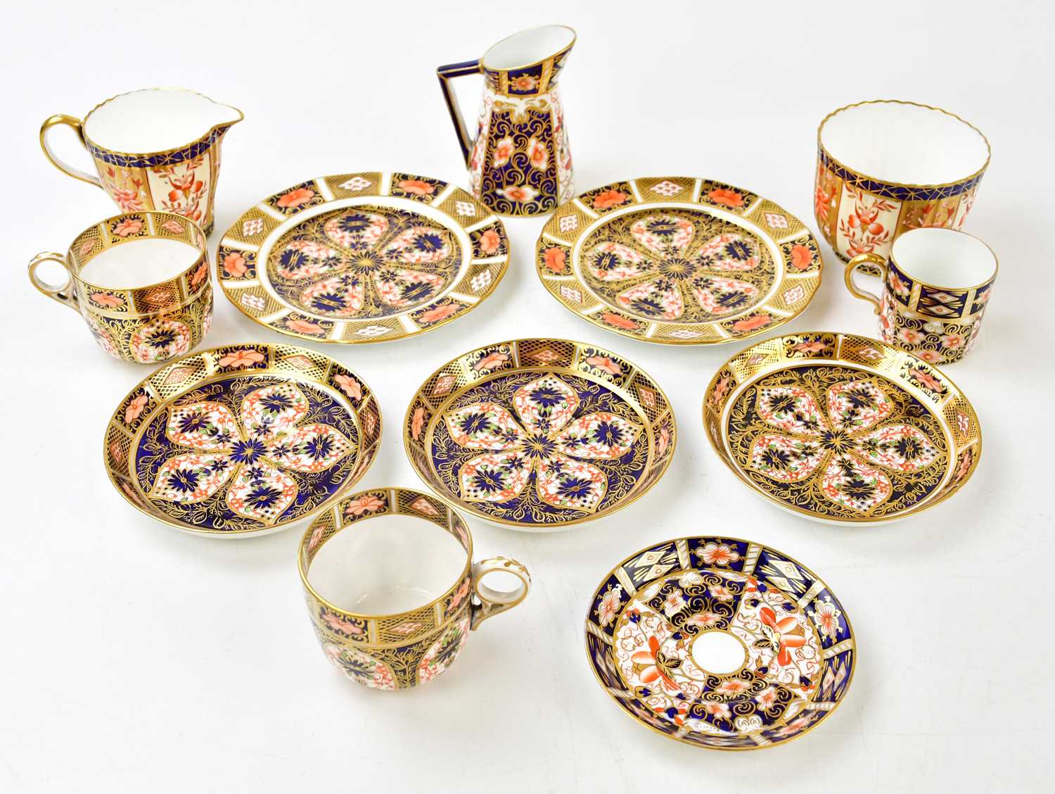 ROYAL CROWN DERBY; a group of Imari decorated wares, comprising three saucers, two side plates, a