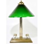 A brass plated desk lamp, the conical green glass shade on cylindrical column terminating on a