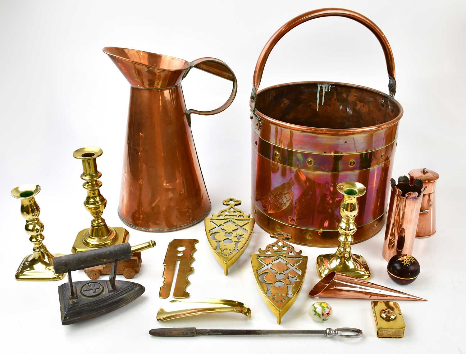 A small quantity of copper and brass to include a pair of brass candlesticks, a brass log bucket,