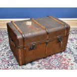 A wood and canvas travelling trunk, height 45cm, width 77cm, depth 50cm.