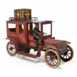 CARETTE; a vintage German tinplate clockwork limousine, with original travelling trunk, lantern