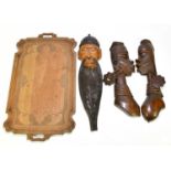 A collection of African and Thai carved items to include a pair of wall masks, a similar mask of a