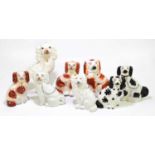 A group of eight Staffordshire porcelain dogs, largest 32cm.
