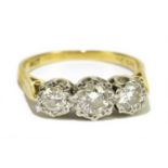 A 18ct yellow gold three stone diamond ring, size O, approx weight 4.3g.