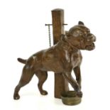 A circa 1900 bronzed spelter figure of a pitbull terrier tethered to a post, length 23cm.Condition