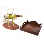 A champagne pourer, together with a mahogany tray.