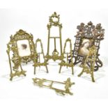 A group of six small brass easels, together with a brass photograph frame and a further spelter
