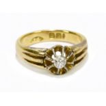 An 18ct yellow gold ring set with a small diamond, 4.6g.