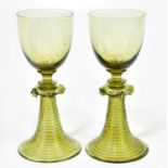 BLACKPOOL INTEREST; a pair of 20th century green wine glasses in the antique German style, with bell
