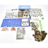 A collection of predominantly British coins and bank notes including Great Britain shillings,