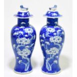 A pair of 19th century Chinese blue and white lidded vases, height 30cm.Condition Report: One