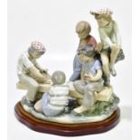 NAO: a figure group of children playing cards, height 35cm.Condition Report: Minor chips and surface