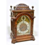 LENZKIRCH; an early 20th century German burr walnut veneered mantel clock with four gilt metal