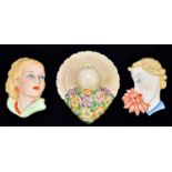 ROYAL DUX; a wall mask of woman smelling a flower, stamped to the back 15516, together with