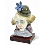 LLADRO; a bust of a clown, on wooden base, height including base 28cm.Condition Report: Light