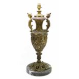 A large decorative gilt twin handled lamp raised on circular veined marble base, height including