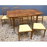 MCINTOSH; a teak mid century dining table and chairs, the shaped rectangular extending dining