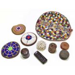 A group of African art, comprising four pieces of beadwork, a shell adorned pot and cover, a woven