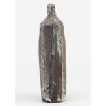† AKI MORIUCHI (born 1947); a fluted stoneware bottle with heavily textured surface, impressed mark,