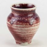 † ADRIAN LEWIS-EVANS (1927-2021); a porcelain jar partially covered in copper red glaze, impressed