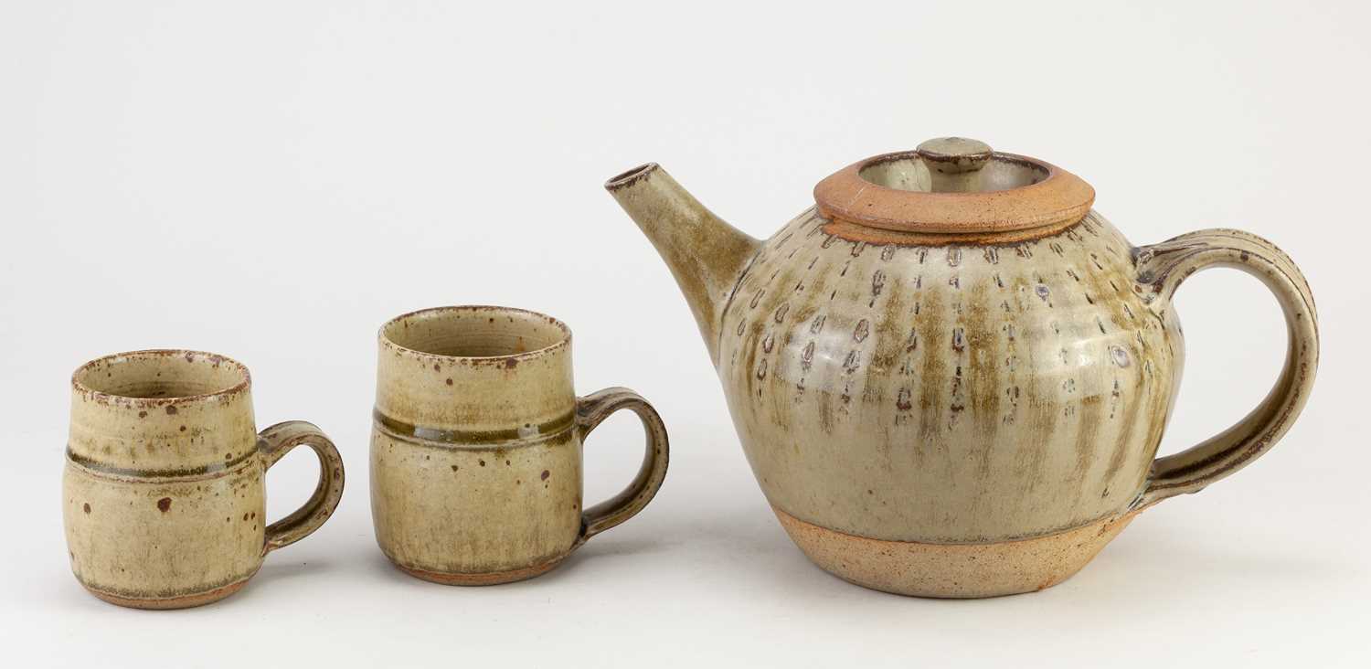 † RICHARD BATTERHAM (1936-2021); a stoneware teapot covered in green ash glaze, height 15cm, and a