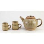 † RICHARD BATTERHAM (1936-2021); a stoneware teapot covered in green ash glaze, height 15cm, and a