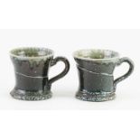 † WALTER KEELER (born 1942); a pair of salt glazed mugs, impressed marks, height 8.5cm (2).