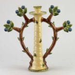 † PAUL YOUNG (born 1961); a slip decorated earthenware candlestick, impressed PY mark, height 29cm.