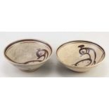 † SVEND BAYER (born 1946); a pair of stoneware bowls decorated with birds, diameter 17cm (2).