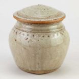 † RICHARD BATTERHAM (1936-2021); a stoneware beaten caddy covered in green ash glaze with chattering
