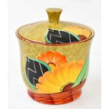 CROWN DEVON; an Art Deco hand painted tobacco jar and cover, with floral decoration, height 16cm.