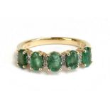 A 14ct yellow gold emerald and diamond ring, size L1/2, sold with World Gemological Institute gem