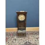 INTERNATIONAL TIME RECORDING COMPANY, LONDON; an oak cased clocking in clock, height 112cm.