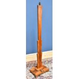 An Art Deco walnut standard lamp of angular form on rectangular plinth base, height excluding