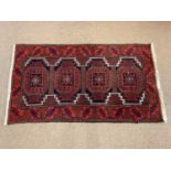 A red ground Sheriz carpet, 160 x 88cm, together with an orange ground Keshan rug, 95 x 60cm.