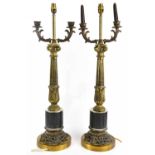 A pair of reproduction Corinthian column table lamps, height 81cm.