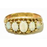 An 18ct yellow gold five stone opal oval ring, size L, 3.9g.