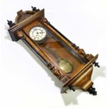 A walnut veneered stained pine a walnut Vienna style wall clock, with arched pediments, the dial set