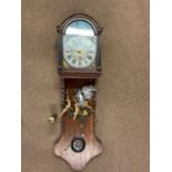 A circa 1900 Dutch oak wall clock with painted dial, winged finials and shaped case, height