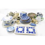 A quantity of blue and white ceramics to include plates, tureens, with further teapots and mugs.
